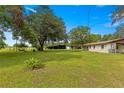 Property boasts a large barn and expansive grassy yard at 1000 Se 155Th St, Summerfield, FL 34491