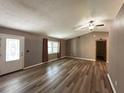 Bright living room with wood floors, natural light and an open concept at 5877 Nw 64Th St, Ocala, FL 34482
