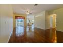 Spacious living room features sleek hardwood floors, leading to a sliding door that opens to the outdoors at 15268 Sw 14Th Avenue Rd, Ocala, FL 34473