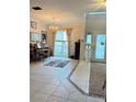 Living room featuring tiled floors and a piano at 2733 Scarborough Dr, Kissimmee, FL 34744