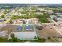 Aerial view of the property's location within a charming community with lush green trees and clear blue skies at 10107 Sw 41St Ave, Ocala, FL 34476