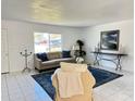 Comfortable living room with large window providing natural light and stylish decor at 11 Cedar Trace Crse, Ocala, FL 34472