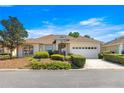 Charming single-story home with manicured landscaping and attached two car garage at 9882 Sw 89Th Lane Rd, Ocala, FL 34481