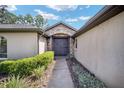 Elegant entryway with stonework and double doors at 5135 Nw 82Nd Ct, Ocala, FL 34482