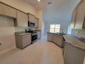 Modern kitchen featuring stainless steel appliances and granite countertops at 7658 Sw 102Nd Loop, Ocala, FL 34476