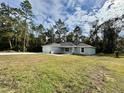 Newly built home on a spacious lot with a grassy yard and mature trees at 19682 Sw 93Rd Ln, Dunnellon, FL 34432