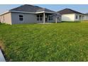 Spacious backyard with lush lawn, ideal for outdoor entertaining and relaxation at 5892 Sw 82Nd Ln, Ocala, FL 34476