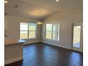 Bright living room with hard wood floors and large windows offering ample natural light at 4557 Ne 31St St, Ocala, FL 34470