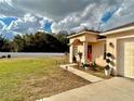 Lovely front yard featuring a walkway, a pristine lawn, and a white fence at 8335 Se 162Nd Pl, Summerfield, FL 34491