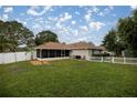 This home boasts a spacious fenced-in backyard with a screened-in lanai and room for outdoor dining at 10291 Se 42Nd Ter, Belleview, FL 34420
