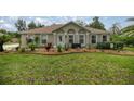 Charming home with a well-manicured lawn and garden at 10291 Se 42Nd Ter, Belleview, FL 34420