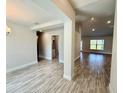 Bright living room features tile floors and neutral walls, creating a modern and inviting space at 9869 Se 157Th Ln, Summerfield, FL 34491
