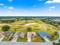 Aerial view showcasing a single-Gathering home in a golf course community at 12576 Se 97Th Terrace Rd, Summerfield, FL 34491