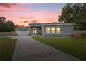 Spacious living room with ample seating and large TV at 10250 Sw 82Nd Ct, Ocala, FL 34481