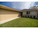 Charming single-story home with a well-maintained lawn, garden beds, and brick accents, providing comfortable suburban living at 10817 Se 51St Ave, Belleview, FL 34420