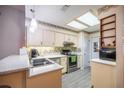 Cozy kitchen with laminate countertops, stainless steel appliances, and a stylish backsplash, creating a functional cooking space at 10817 Se 51St Ave, Belleview, FL 34420