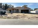 New construction home exterior featuring a two-car garage and neutral color palette at 11610 Sw 59Th Terrace, Ocala, FL 34476