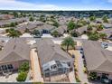 Residential neighborhood, with a bird's eye view of backyard, patio, and screened-in porch at 973 Buster Pl, The Villages, FL 32162