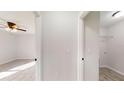 Bright hallway with doors to bedrooms and laundry room at 11 Emerald Trl, Ocala, FL 34472