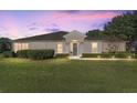 Charming single-story home featuring well-maintained landscaping and a beautiful lawn at 7066 Sw 91St Ct, Ocala, FL 34481