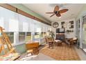 Relaxing sunroom, wicker furniture, and garden view at 7066 Sw 91St Ct, Ocala, FL 34481