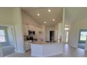 Bright kitchen with white cabinets, granite countertops, and stainless steel appliances at 8357 Sw 58Th Ave, Ocala, FL 34476
