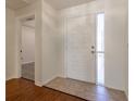 Bright entryway with wood floors and white door at 2444 Se 18Th Cir, Ocala, FL 34471