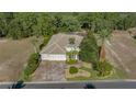 Stunning home featuring a three-car garage, well-manicured landscaping, and a tile roof at 17819 Sw 61St Lane Rd, Dunnellon, FL 34432