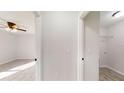 Hallway with doors leading to bedrooms and laundry area at 232 Locust Pass, Ocala, FL 34472