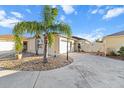 Charming single-story home with a well-manicured yard and driveway that lead to a one car garage at 1106 Liendo Ln, The Villages, FL 32162