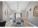 Dining room with a long table, seating for eight, and decor at 2880 Se 34Th St, Ocala, FL 34471