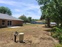 Backyard with a lush green landscape provides a serene outdoor retreat at 3733 Se 137Th Street, Summerfield, FL 34491
