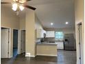 Open kitchen with stainless steel appliances and an island at 4131 Se 130Th Pl, Belleview, FL 34420