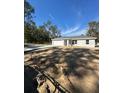 New house showcasing a front yard and gray siding at 15923 Sw 41St Street Rd, Ocala, FL 34481