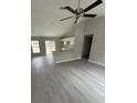 Open living room with vinyl plank flooring and kitchen view at 15923 Sw 41St Street Rd, Ocala, FL 34481