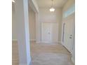 Bright entryway with tile flooring, double doors, and high ceilings at 7695 Sw 103Rd Loop, Ocala, FL 34476