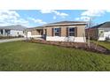 Side view of the house, showcasing the landscaping at 9769 Sw 79Th Lane Rd, Ocala, FL 34481