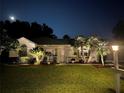 Attractive single-story home with landscaping at night at 5226 Nw 21St Loop, Ocala, FL 34482