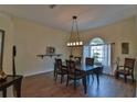 Formal dining room with hardwood floors and a chandelier at 5622 Nw 27Th Pl, Ocala, FL 34482