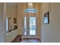 Bright entryway with a decorative glass door and a small bench at 5622 Nw 27Th Pl, Ocala, FL 34482