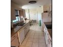 Kitchen with light cabinets, double sink, and appliances at 35 Hemlock Terrace Dr, Ocala, FL 34472