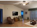 Bright living room with hardwood floors, comfortable seating, and access to a patio at 8475 Sw 109Th Lane Rd, Ocala, FL 34481