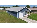 Single Gathering home featuring a one car garage and covered front porch at 3496 Sw 149Th Ct, Ocala, FL 34481