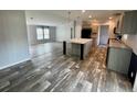 Bright and airy living room flowing into kitchen, boasting modern flooring and an open layout at 11605 Nw 20Th St, Ocala, FL 34482