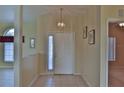 Bright entryway with tiled floor and access to other rooms at 5520 Nw 26Th Ln, Ocala, FL 34482