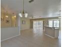 Open concept living and dining area with tile floors at 5520 Nw 26Th Ln, Ocala, FL 34482