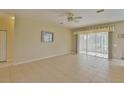 Spacious living room with tile floors and sliding glass doors at 5520 Nw 26Th Ln, Ocala, FL 34482