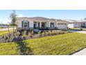 One-story house with a two-car garage and a landscaped yard at 10832 Sw 101St Loop, Ocala, FL 34481