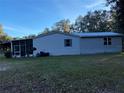 Charming manufactured home with metal roof and enclosed porch at 11064 Ne 212Th Ln, Fort Mc Coy, FL 32134