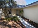 Charming entryway with walkway, landscaping, and room for seating at 9117 Sw 93Rd Cir, Ocala, FL 34481